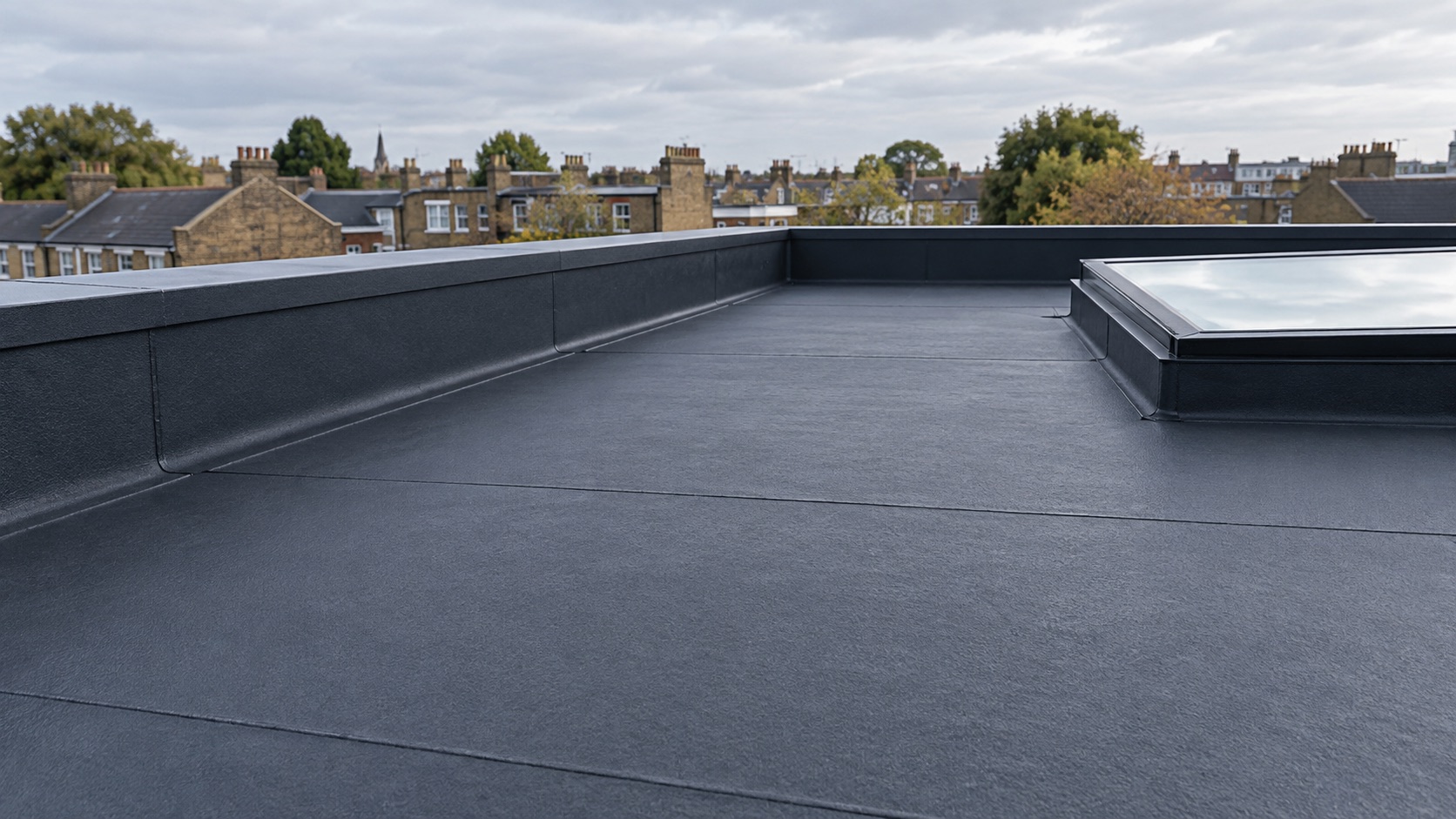 Flat roof with charcoal waterproofing, rooflight and London rooftops.